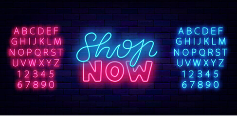 Shop now neon label on brick wall. Glowing lettering. Sale signboard. Special offer emblem. Vector stock illustration