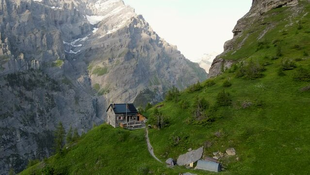 Aerial footage of Balmhorn h&uuml;tte above Gasterntal in Switzerland