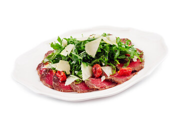 Meat carpaccio with arugula and parmesan cheese