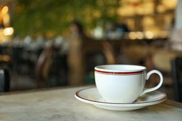 A cup of coffee on a table in a cafe