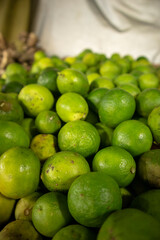 Lime fruit in a market close up image.