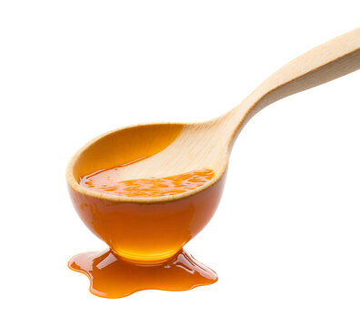 Wooden Spoon with Honey Isolated on White Background