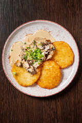 potato pancakes with sour cream and meat