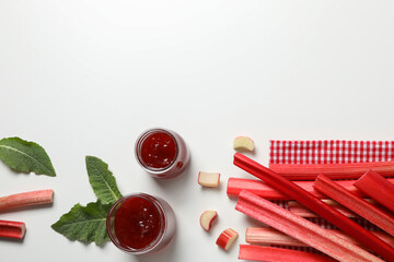 Rhubarb stalk, mint, jar of jam on white background, space for text