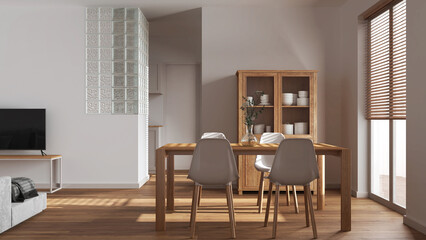 Scandinavian dining and living room in white tones. Wooden table with chairs, glass block wall. Cabinets and sofa. Japandi interior design