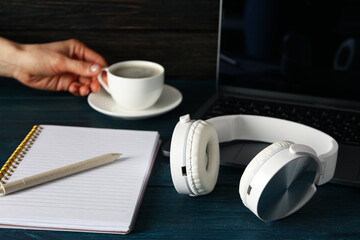 Concept of freelance, composition with hot drink and headphones