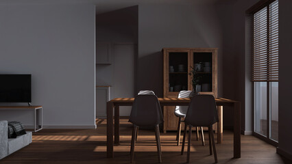 Dark late evening scene, minimal dining and living room. Wooden table with chairs, partition wall over contemporary kitchen. Japandi modern interior design