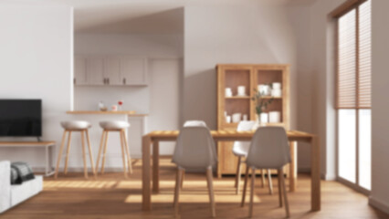 Blurred background, minimal wooden dining and living room. Scandinavian table with chairs, partition wall with island and stools over japandi kitchen. Modern interior design