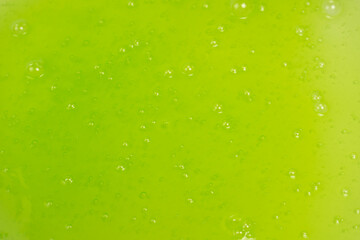 Green slime toy as a background.