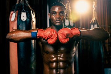 Boxing fighter posing, African American Black boxer put his hand or fist wearing glove together in...