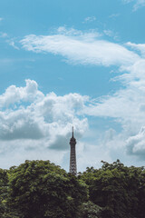 Obraz premium Eiffel Tower over beautiful blue cloud sky Paris France