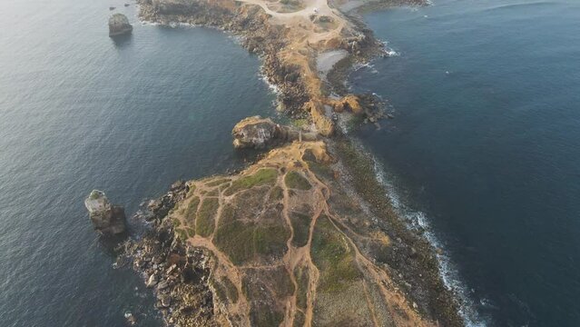 Aerial view of Ilheu da Papoa, a small island in Peniche facing the Atlantic Ocean, Leiria, Portugal.