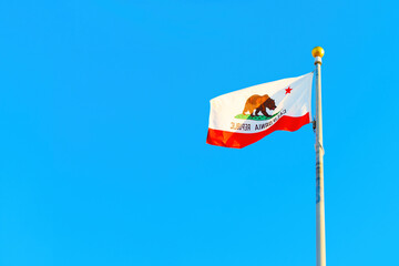 California State Flag on Flagpole against Blue sky