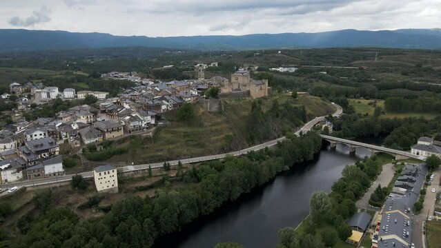 Aerial view of Puebla de Sanabria, a small town with a medieval castle along the Rio Tera river in Zamora, Spain.