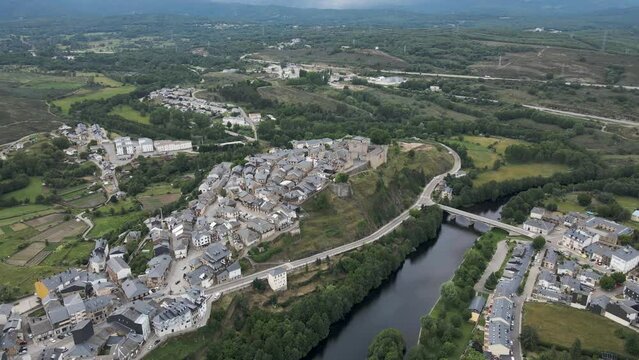 Aerial view of Puebla de Sanabria, a small town with a medieval castle along the Rio Tera river in Zamora, Spain.