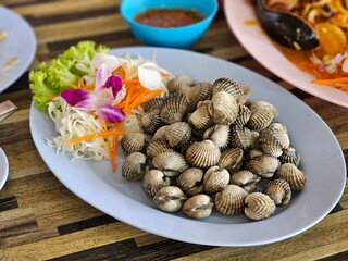 Boiled cockles with seafood sauce