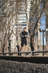 Young handsome man running in the park