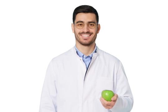 Portrait of smiling dentist or nutritionist doctor wearing white coat with fresh green apple in hand