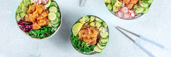 Poke bowl variety panorama. Healthy Hawaiian dish with salmon, tuna, and shrimps, with chopsticks, a panoramic banner
