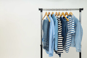 Wardrobe rack with different clothes, concept of different clothes