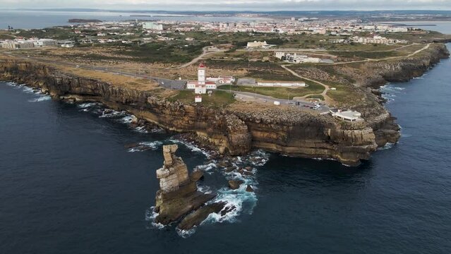 Aerial view of Cabo Carvoeiro lighthouse a sunset in Peniche, Leiria, Portugal.