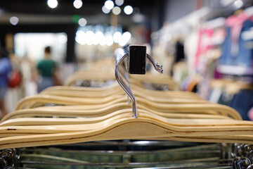 Hangers in the store, close-up selective focus.