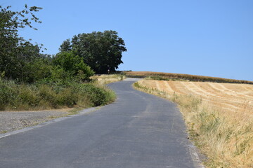 Country Road up the hill to a barrier