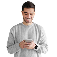 Young man standing, looking at screen of phone, browsing web and smiling