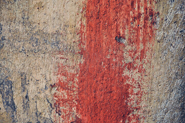 Fototapeta premium Grey, Abstract background of the shabby concrete wall surface with bright red yellow paint and mossy weathered parts
