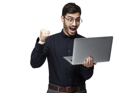 Happy excited  businessman holding laptop and raising his arm up to celebrate achievement