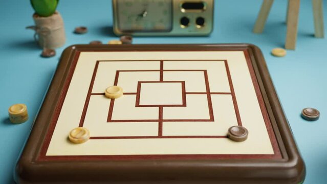 People Playing Nine Men Morris Board Game Challenge