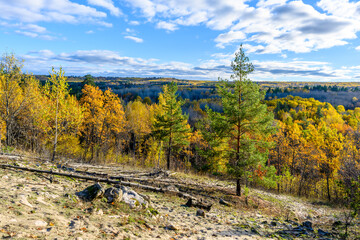 Autumn landscape, nature in the mountains in autumn, rocks, mountains, hills. Landscape with rock in forest.