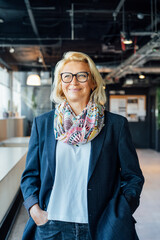 Portrait of smiling 50's stylish, confident mature businesswoman, middle aged company ceo director, experienced senior female professional, business coach team leader in modern office. Female leader - obrazy, fototapety, plakaty