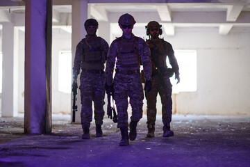 Soldier squad team walking in urban environment colored lightis