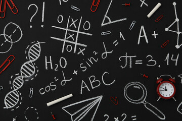 Fototapeta na wymiar School formulas and drawings on a black school board