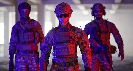 Soldier squad team walking in urban environment colored lightis