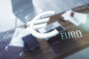 Creative concept of EURO symbols illustration and modern desktop with computer on background. Trading and currency concept. Multiexposure