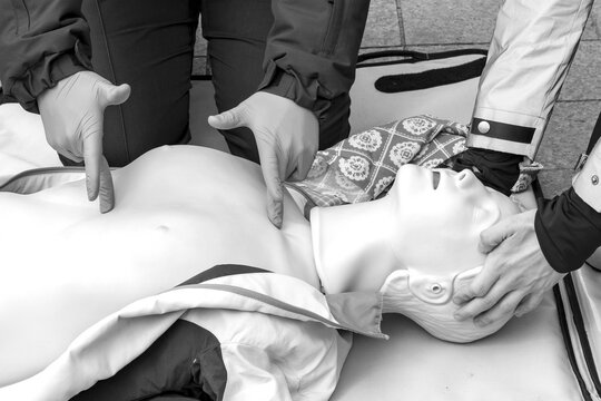Hands of a Policeman on a mannequin during an exercise of resuscitation. CPR First Aid Training Concept.Urgent Care.