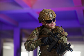 A professional soldier undertakes a perilous mission in an abandoned building illuminated by neon blue and purple lights