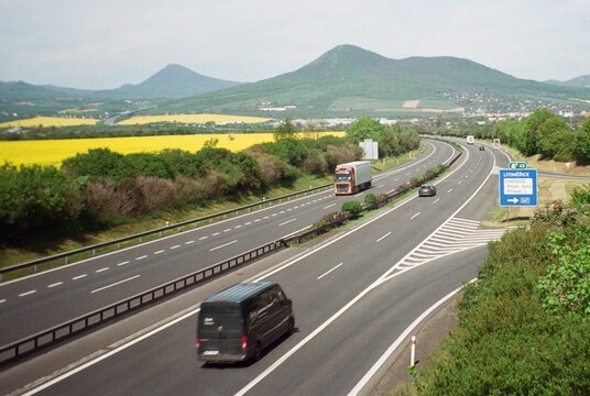 Lovosice, Czechia - May 08, 2023: highway D8 with Hill Lovos - analogue