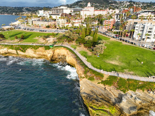 Fototapeta na wymiar La Jolla, San Diego, California, from a UAV Aerial Drone looking at Park along the Cliffs with people enjoying the day with a Beautiful Shoreline View