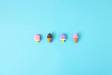 Colorful ice creams on a blue background. Minimal food concept.