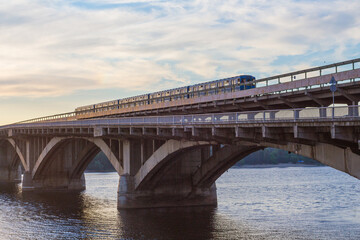 Fototapeta na wymiar View of the Metro Bridge in the city of Kyiv at dawn. Ukraine