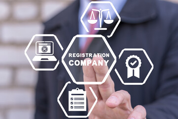 Businessman using virtual touch screen presses inscription: REGISTRATION COMPANY. Concept of new...