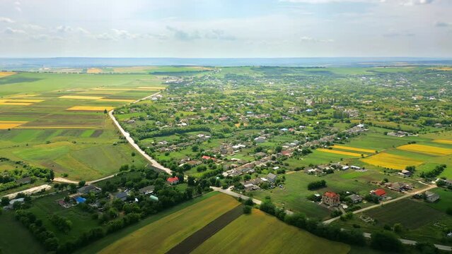Aerial drone view of Fetesti, Moldova. Village with multiple residential buildings and greenery