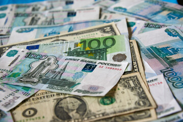 Fototapeta na wymiar background of paper bills dollars, euros and rubles. Currency exchange rate