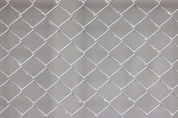Fototapeta premium wire fence on the white wall background.