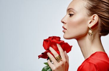 Close up portrait of a beautiful elegant woman with stylish jewelry on a white background....
