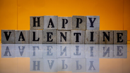 Happy valentine's day from stacked wooden blocks