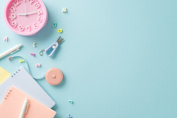 Unlock your full potential with this top-view composition showcasing stationery essentials and...